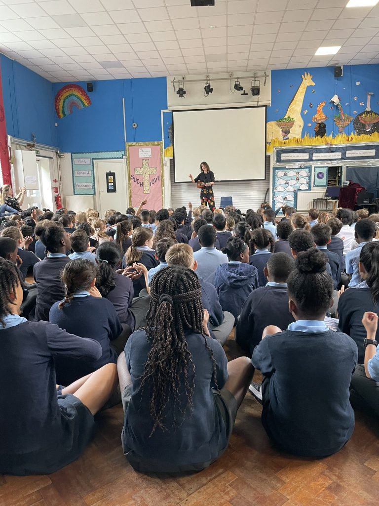 an assembly with around 230 kids, vanessa is telling stories and they are enthralled